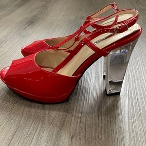 Red shinny high heel shoes size 7